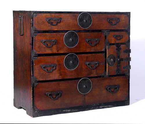 A TANSU OF RUST BROWN STAINED WOOD WITH FIVE LARGE CHERRY BLOSSOM-ENGRAVED MEDALLION FITTINGS.