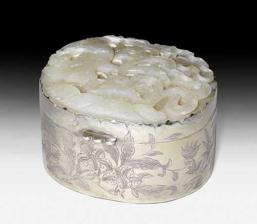 A SILVER BOX WITH JADE COVER SHOWING A GOOSE AMONG LOTUSES.