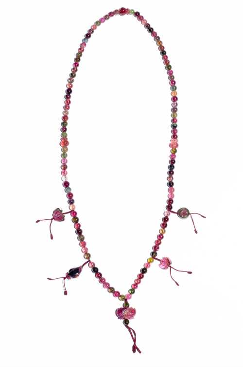 A TOURMALINE NECKLACE IN THE STYLE OF A BUDDHIST MALA WITH 108 BEADS AND FIGURATIVE PENDANTS.
