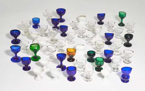 LOT COMPRISING AROUND 50 GLASS EYE CUPS.
