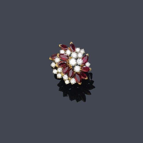 A RUBY AND DIAMOND RING, circa 1950. Yellow and white gold 750. Set with 10 rubies of a total of ca. 1.70 ct and 18 diamonds of a total of ca. 1.80 ct. Size 56.
