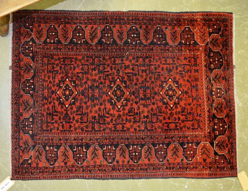 AFGHAN old.Rust coloured ground with black plant motifs, 100x145 cm.