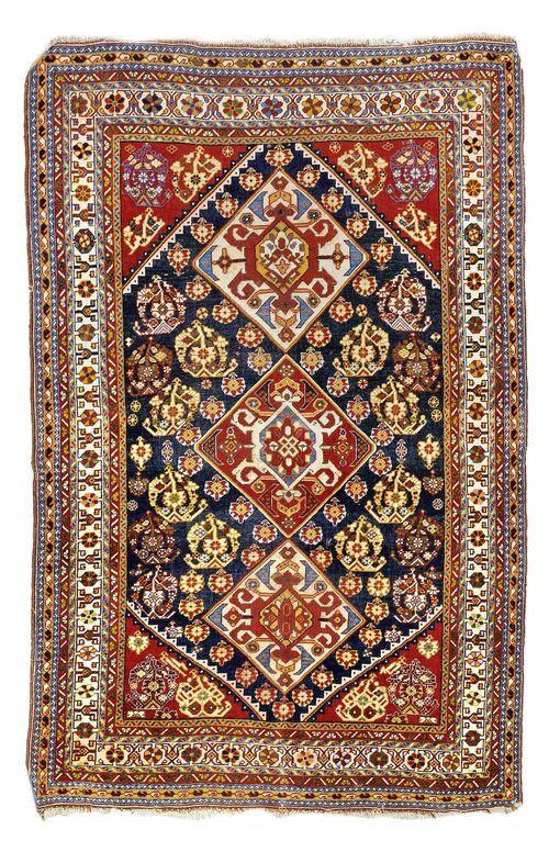 GASCHGAI SHEKARLU antique.Blue ground with red corner motifs and three medallions, patterned with stylized boteh motifs, stepped edging, signs of wear, 114x176 cm.