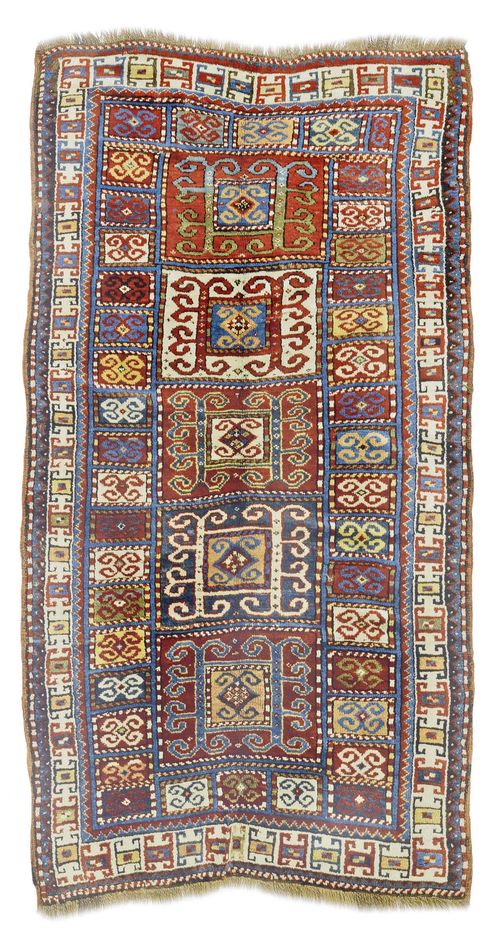 KARATCHOPH antique.Central field with rectangles subdivided with a geometric pattern, white border, 130x245 cm.