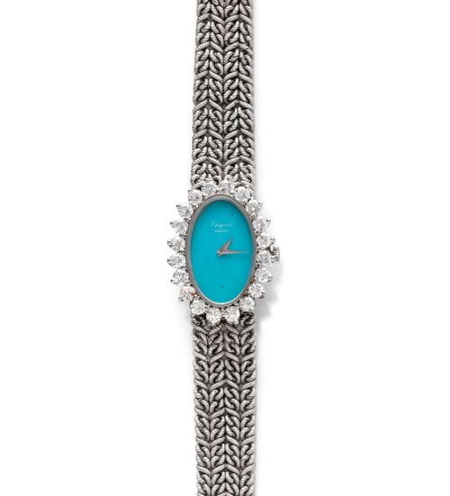 DIAMOND LADY'S WRISTWATCH, CHOPARD, 1970s. White gold 750, 43g. Ref. 5026 1. Oval case No. 35845, with brilliant-cut-diamond lunette weighing ca. 2.00 ct. Turquoise-coloured dial with silver-coloured hands, signed. Hand winder, movement Cal. 664, signed. Braided, textured gold band, signed LUC, L ca. 17.5 cm. D 29 x 22 mm.