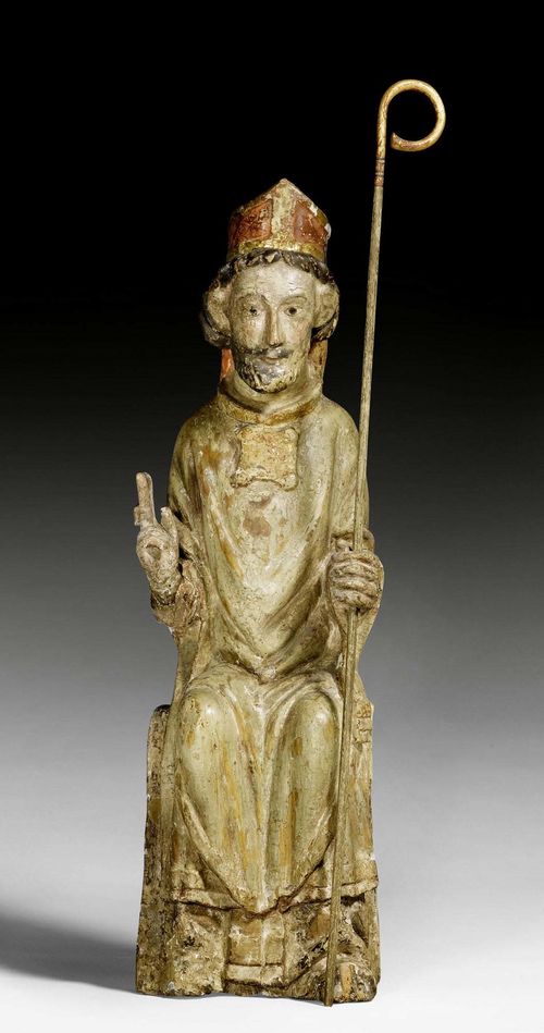 ENTHRONED BISHOP,France or Spain, 12th/13th century. Carved poplar wood, hollowed verso (previously closed), with remains of painting. The staff in left hand later. H 80 cm.