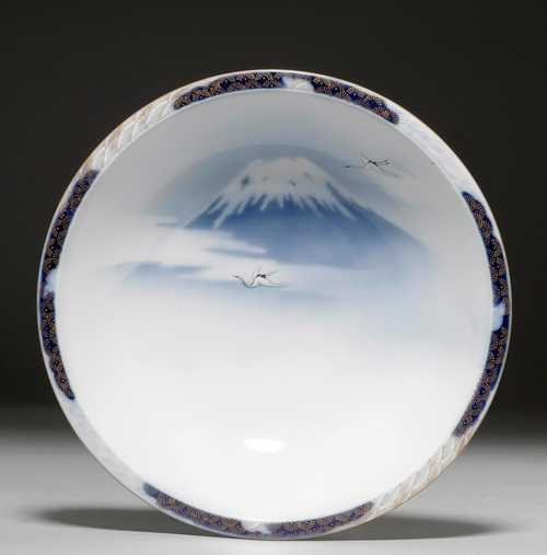 A DEEP BLUE AND WHITE DISH PAINTED WITH MOUNT FUJI .