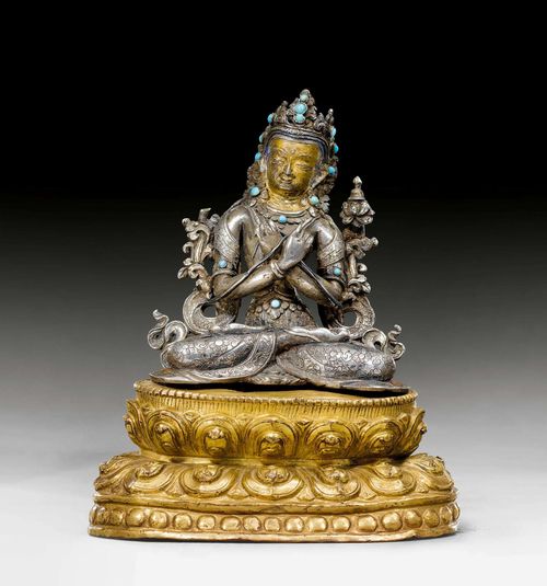 A SILVER FIGURE OF VAJRADHARA ON A GILT COPPER REPOUSSE LOTUS BASE. Nepal, 16th/17th c. Height 14.5 cm.