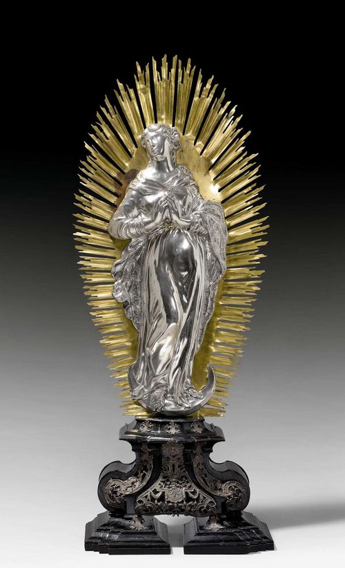 MARY IN GLORIOLE. Augsburg 1716.Maker's mark: Franz Anton Bettle (Betli), (born in Constance, master from 1715, died 1728). Wood base with pierced silver appliques. Gilt copper gloriole. H 82 cm.
