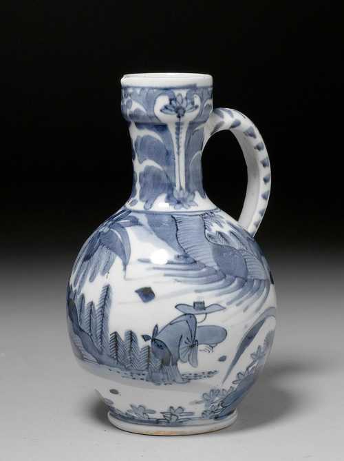 BLUE-AND-WHITE HANDLED JUG SHOWING FIGURES IN A LANDSCAPE.
