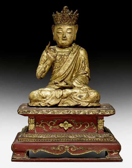 A LACQUER GILT WOOD FIGURE OF THE SEATED VAIROCANA.