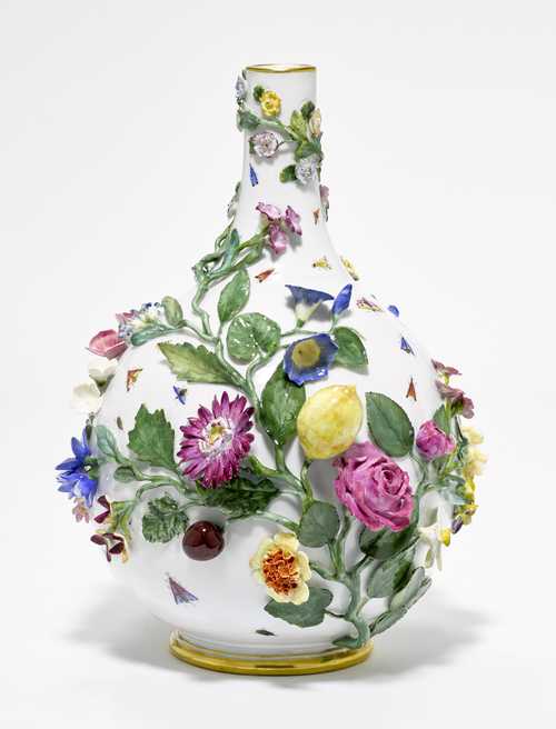 An ORNAMENTAL VASE WITH APPLIED FLOWERS AND FRUIT,