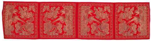 A RED-GROUND SILVER BROCADE CHAIR COVER.