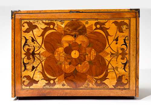 AN INTARSIA-DECORATED CABINET