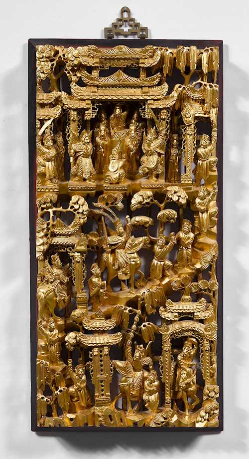 A DECORATIVE CARVED PANEL.