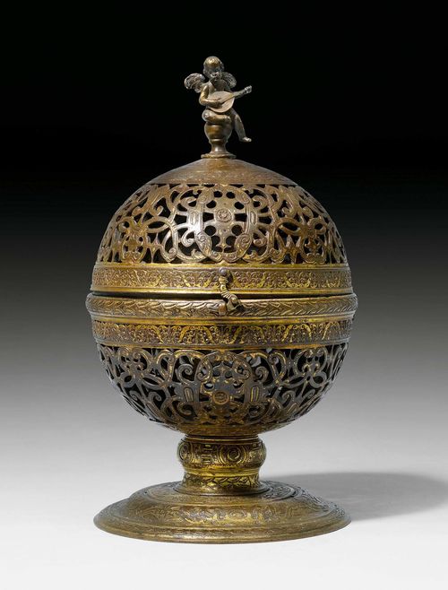 CENSER,Saracenic, probably 15th/17th century. Pierced bronze. Hinged, spherical form surmounted by putto and with later round foot with integrated sundial from the 17th century. The cover with inscription in Arabic: "Oh, to Idriss belongs this censer and also the Kingdom of Maghreb". H 27.5 cm.
