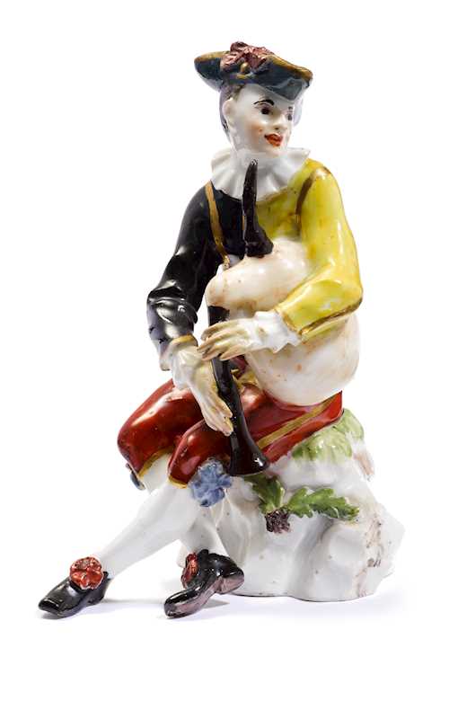 A HARLEQUIN WITH BAGPIPES