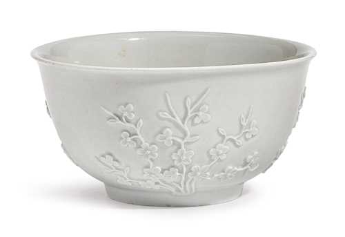 A BOWL WITH RELIEF FLOWERS