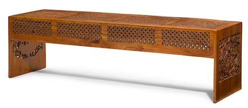 A CARVED WOOD BENCH.
