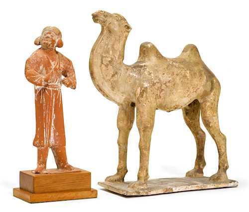 A POTTERY CAMEL WITH GROOM.