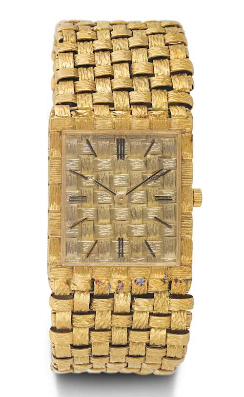 Vacheron & Constantin, elegant wristwatch with gold band.