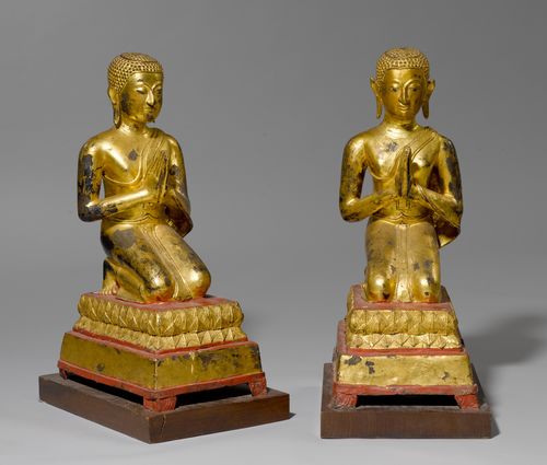 A PAIR OF WORSHIPPERS , OF RED-LACQUERED BRONZE AND GILT BLACK LACQUER.