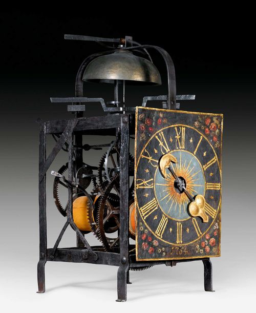PAINTED TOWER CLOCK,Renaissance, Switzerland circa 1520. Chased iron. Later, finely painted dial.  Fine iron movement with striking and clockwork mechanism with balance, pinwheel, hour striking on bell and distinctive hammer. 39x55x92 cm.