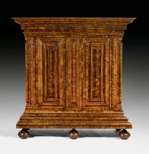 CABINET,known as a "Nasenschrank", Baroque, Zurich or Frankfurt circa 1720. Shaped walnut and burlwood. Large, finely engraved iron lock. 220x82x234 cm.