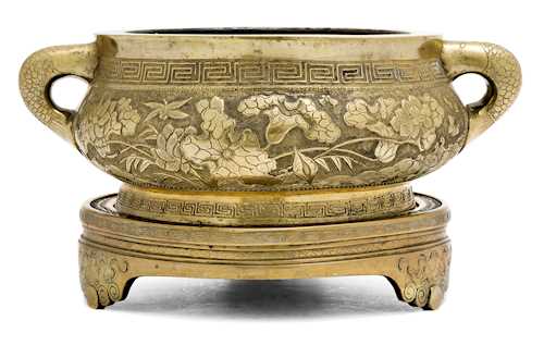 A BRASS TRIPOD CENSER.