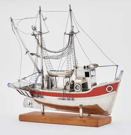 SILVER SHIP ON A WOODEN BASE