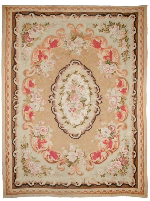 AUBUSSON antique.Beige ground with a floral central medallion, the entire carpet is patterned with flower garlands in delicate pastel colours, 355x430 cm.