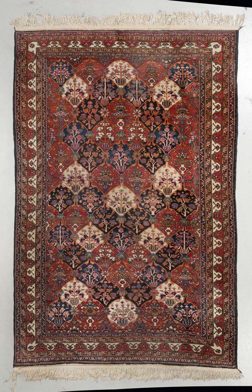 BACHTIAR GARDEN CARPET old.Central field patterned with plant motifs, red and white edging, 187x330 cm.