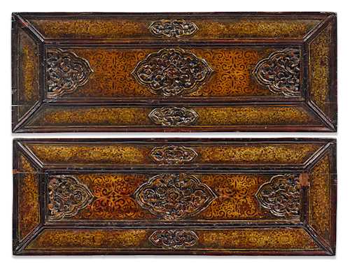 A PAIR OF CARVED AND LACQUERED SUTRA COVERS.