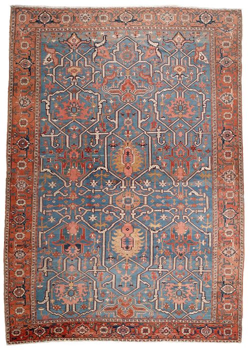 HERIZ SERAPI antique.Blue central field patterned throughout with stylized trailing flowers and palmettes, red edging with tendrils, 360x520 cm.