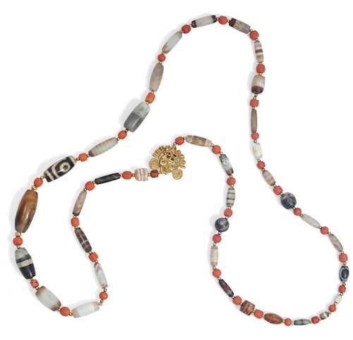 A NECKLACE WITH A DZI STONE.