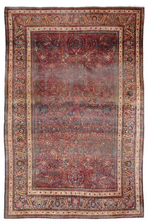 KESHAN MOHTASHEM antique.Red central field, opulently patterned with trailing flowers and palmettes, dark blue edging, worn in parts, 300x420 cm.