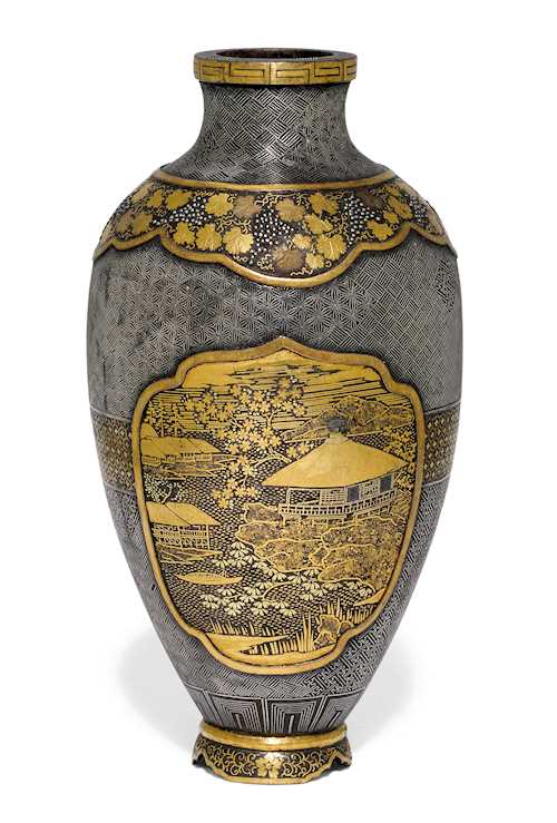 A SMALL INLAID IRON VASE.