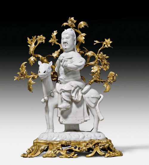 GHUAN DI FIGURE WITH BRONZE MOUNTS,Louis XV, the "Blanc de Chine" porcelain from China, Kangxi (1662-1722), the bronze from Paris, circa 1740/50. Crack in the base. 24x19x34 cm. Provenance: Acquired from G. Orts, Paris.