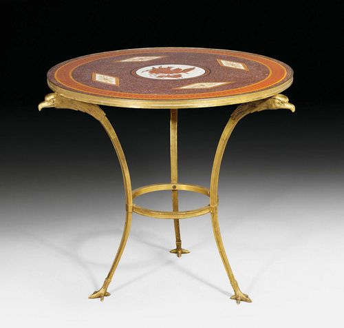 ROUND GUERIDON "AUX AIGLES" WITH PORPHYRY TOP,Directoire, probably Russia, 19th century. Gilt bronze and porphyry. D 80 cm, H 72 cm.