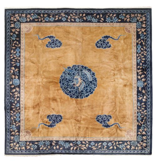 CHINA old.Brown central field with a central medallion, depiction of a dragon with stylised clouds, dark blue edging with trailing flowers, 355x375 cm.