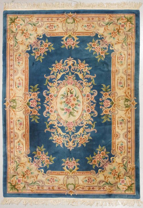 CHINA old.Blue central field with a floral central medallion, beige border with colourful trailing flowers, fragile, 230x320 cm.