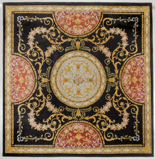 CHINA SAVONNERIE.Black central field with light blue and red medallions, the entire carpet is patterned with trailing flowers in harmonious colours, light blue border, in good condition, 300x300 cm.