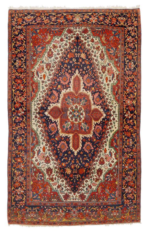 FERAGHAN antique.White ground with a dark blue central medallion and red corner motifs, patterned with stylised plant motifs, in good condition, 120x205 cm.
