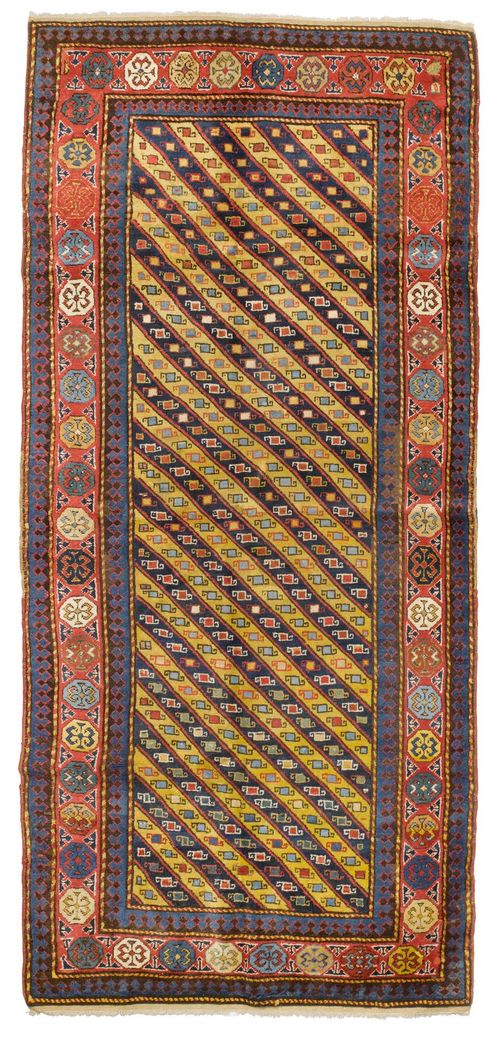 GENDJE antique.Diagonally patterned central field in blue and yellow, geometrically patterned, red border with stylised flowers, 134x263 cm.