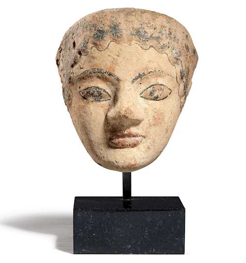 ANTEFIX DESIGNED AS THE HEAD OF A WOMAN