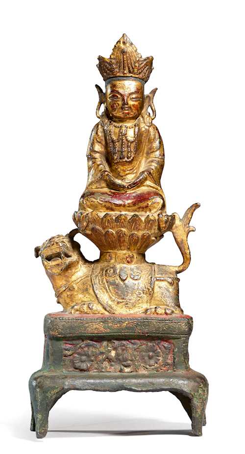 A BRONZE FIGURE OF GWANEUM WITH LION.
