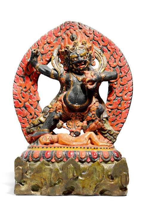 A DRAMATIC PAINTED CLAY FIGURE OF YAMA.
