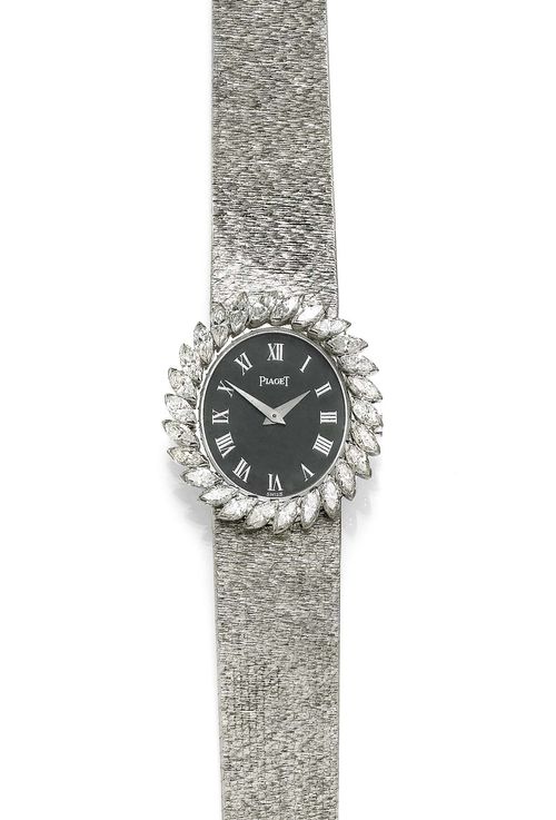 DIAMOND AND MALACHITE LADY'S WRISTWATCH, PIAGET, 1970s. White gold 750, 60g. Oval case No. 9812 21. Lunette decorated with numerous navette-cut diamonds weighing 2.00 ct in total. Malachite dial with silver-coloured Roman numerals and hands. Manual winding, extra-flat movement Cal. 9P, with gold pallet and gold escapement wheel. Textured Milanaise band, L ca. 16.8 cm. D 30 x 27 mm.
