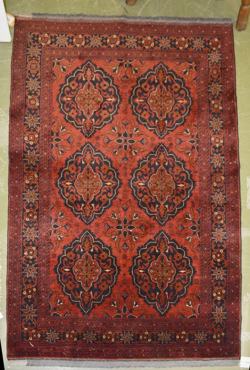 AFGHAN old.Rust colored ground with six medallions, 126x193 cm.