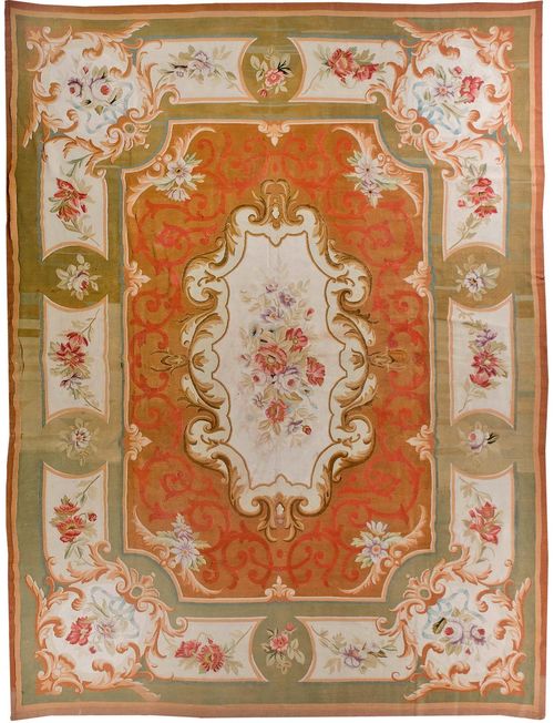 AUBUSSON antique.Brown central field with beige central medallion, finely patterned with floral motifs in delicate pastel colors, green border with flower cartouches, 365x480 cm.